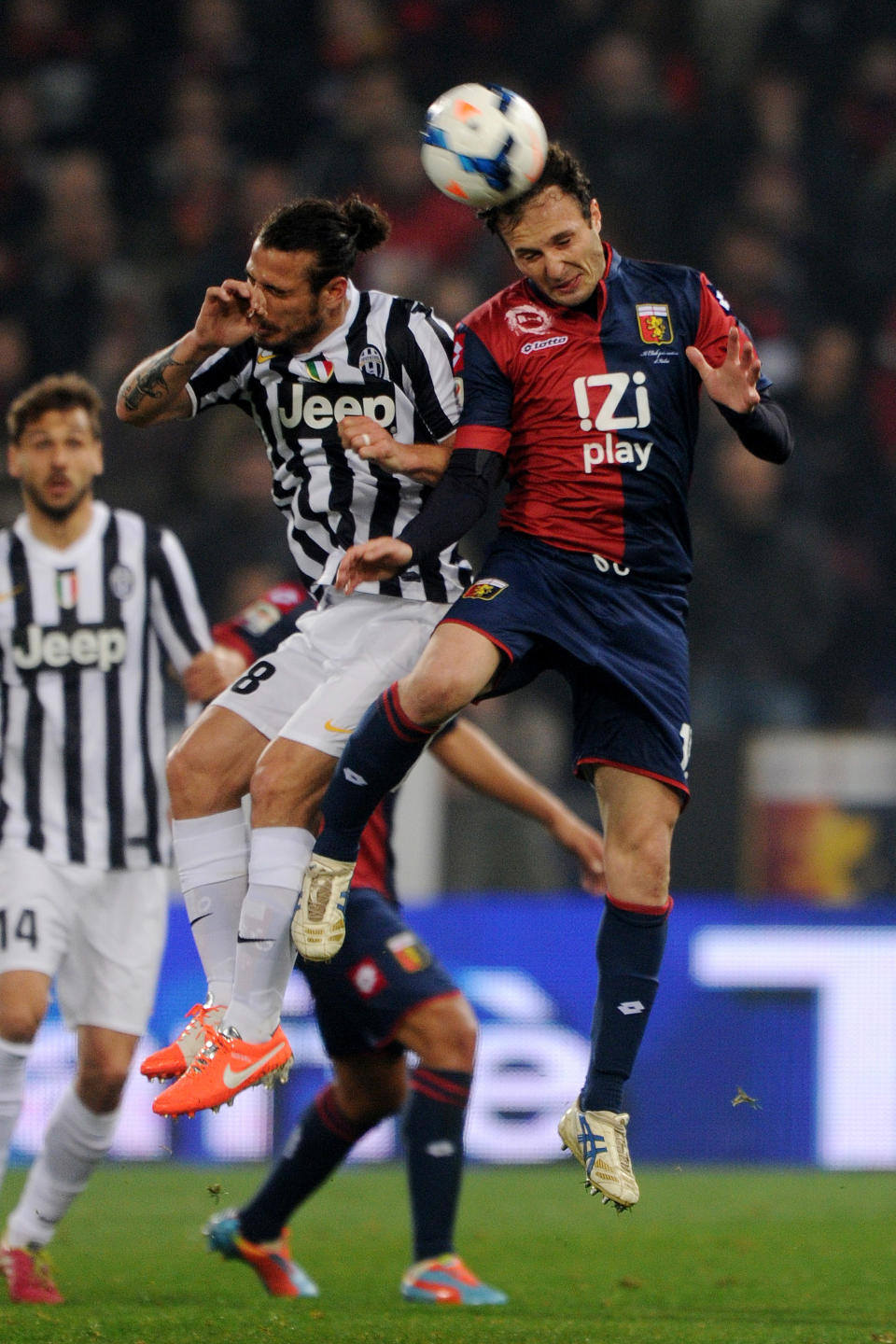 Juventus striker Pablo Osvaldo, left, vies for the ball with Genoa's Giovanni Marchese during a Serie A soccer match between Genoa and Juventus, at Genoa's Luigi Ferraris Stadium, Italy, Sunday, March 16, 2014. (AP Photo/Tano Pecoraro)