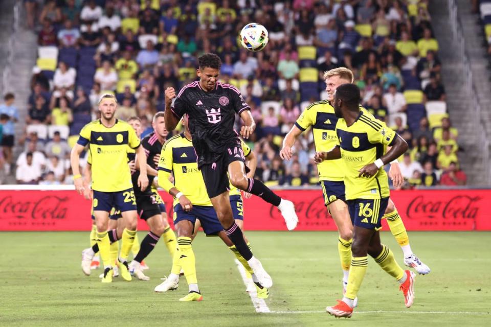 Jun 29, 2024; Nashville, Tennessee, USA; Inter Miami CF defender Ian Fray (17) heads the ball against Nashville SC midfielder Dru Yearwood (16) and forward Sam Surridge (9) in the first half at Geodis Park. Mandatory Credit: Casey Gower-USA TODAY Sports