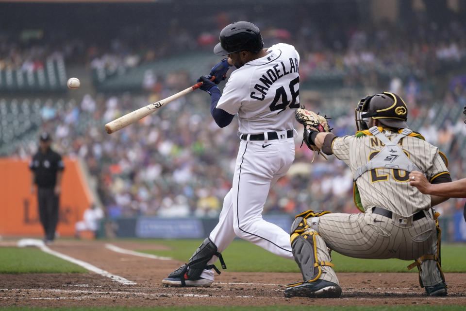 Detroit Tigers' Jeimer Candelario hits a one-run single against the San Diego Padres in the first inning of a baseball game in Detroit, Wednesday, July 27, 2022. (AP Photo/Paul Sancya)