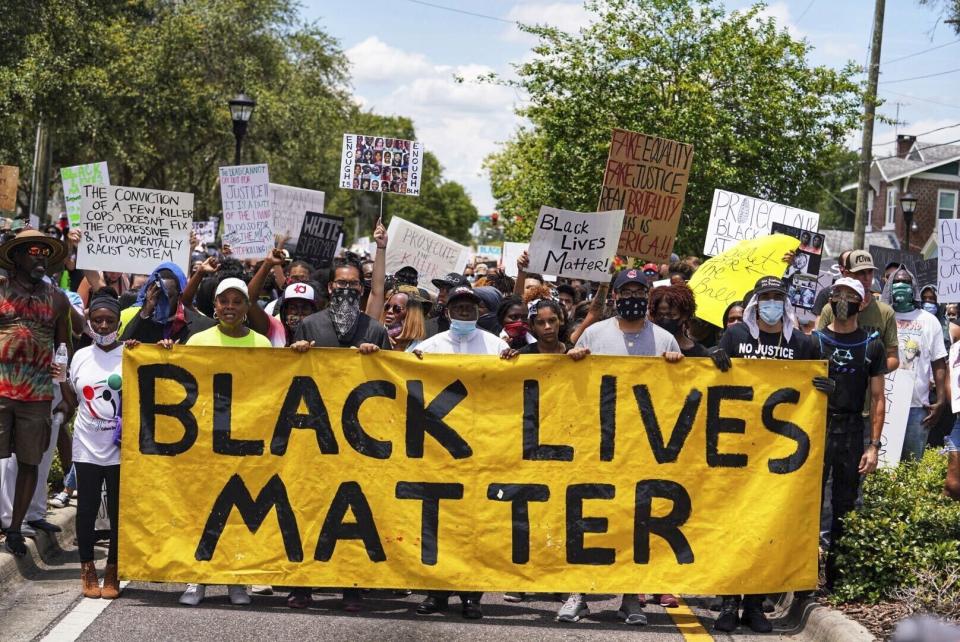 Demonstrators march in Tampa Sunday, May 31, 2020 for a second day in a row as protestors take to the streets of Tampa to protest the Memorial Day death of George Floyd in Minneapolis. (Martha Asencio-Rhine/Tampa Bay Times via AP)