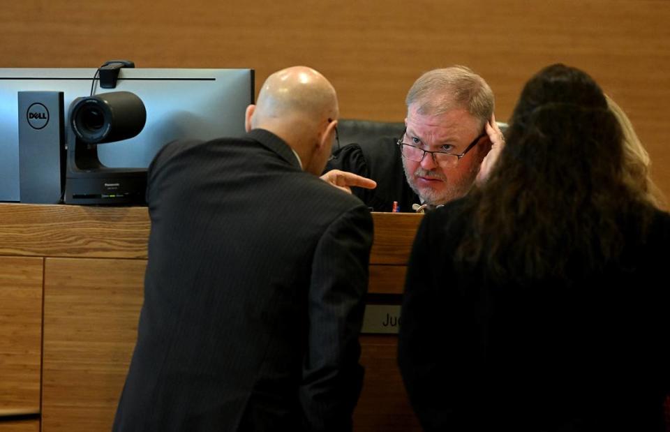 Judge Matt Whyte holds a sidebar with attorneys on the second day of Ashley Benefield’s trial for the second-degree murder of her husband, Doug Benefield, in 2020 at the Manatee County Judicial Center, July 24, 2024.