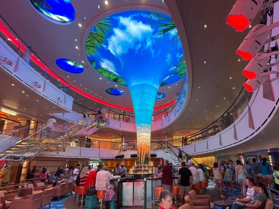 A crowd gathered at the entrance of cruise ship.