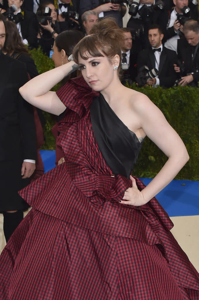 <p>Lena Dunham subtly supported Planned Parenthood at the Met Ball. (Photo: Getty Images) </p>