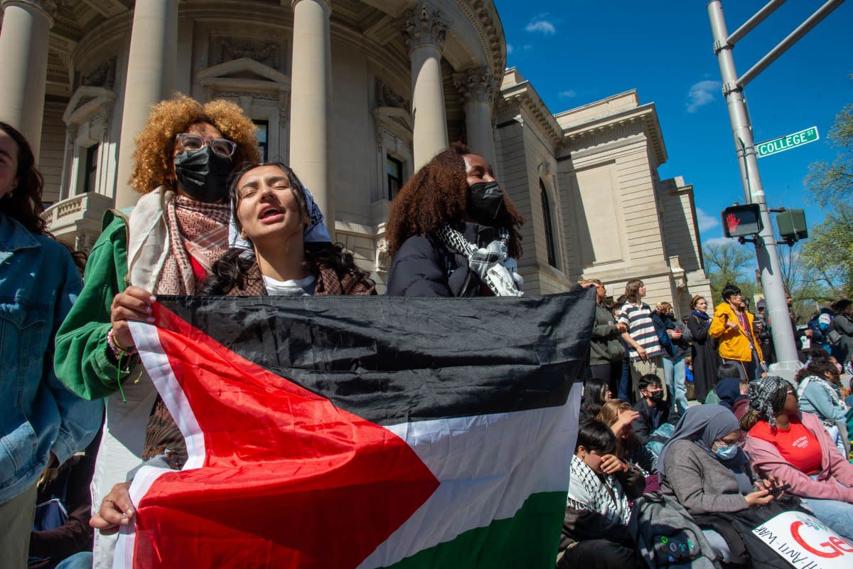 Yale students and protesters sing and rally chants as they block the intersection of College Street and Grove Street, outside Woolsey Hall, in New Haven, Conn., on April 22, 2024.<span class="copyright">Aaron Flaum—Hartford Courant/Tribune News Service/Getty Images</span>