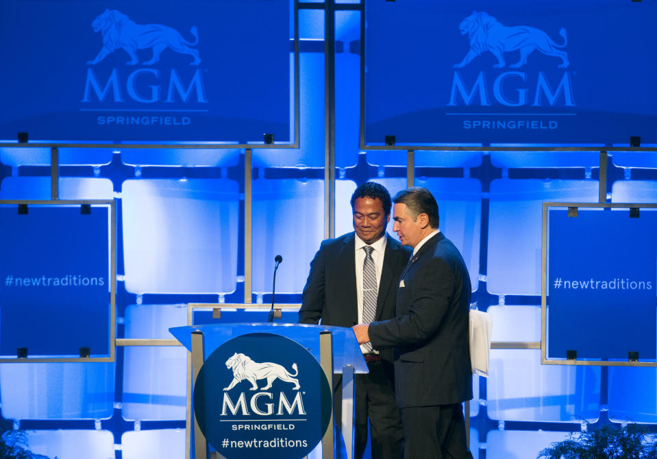 FILE - In this Aug. 23, 2018 file photo, Springfield Mayor Domenic J. Sarno, right, and MGM Springfield President Michael C. Mathis attend a press conference for the grand opening of the $960 million casino in Springfield, Mass. Massachusetts' first Las Vegas-style casino is throwing itself a birthday bash, Saturday, Aug. 24, 2019, with Aerosmith, New England Patriots cheerleaders and a five-tier cake. But one year after opening, MGM Springfield has underperformed and shed hundreds of jobs. Some business owners also say the promised downtown revival hasn't materialized. (Greg Saulmon /The Republican via AP)