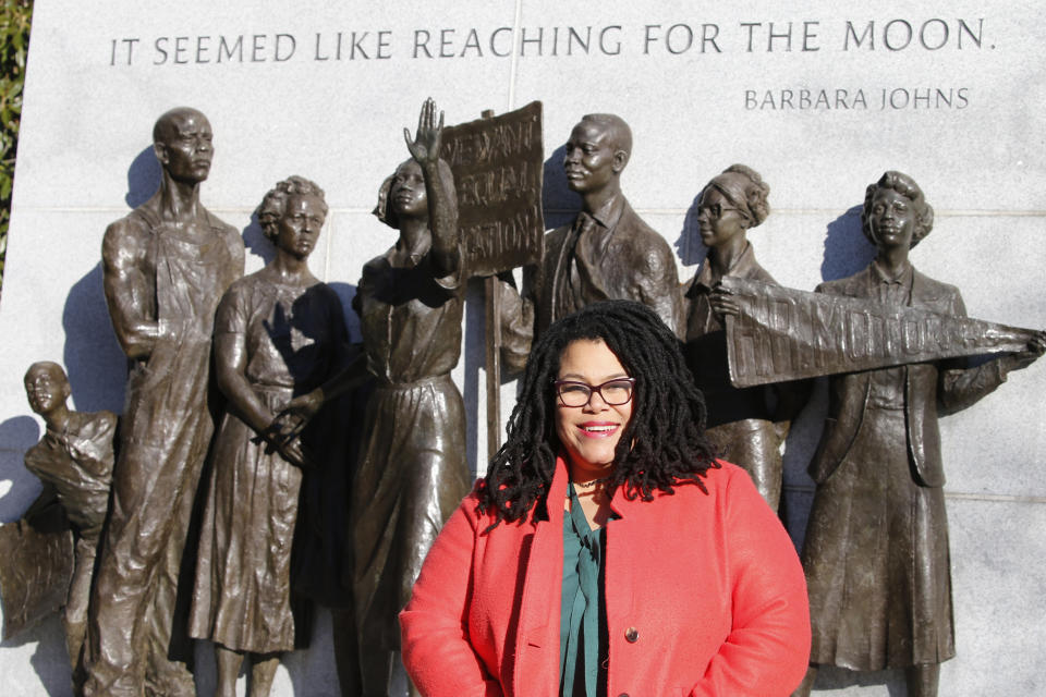 Wake Forest alumni Palinda Carrington poses in front of the Virginia Civil Rights Monument on Capitol Square in Richmond, Va., Sunday, Dec. 15, 2019. The school struggled with racial issues in the last school year and how it's addressed them will be a topic for the new school year. (AP Photo/Steve Helber)