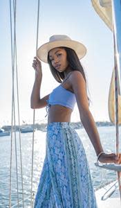 California Fresh model Tori Bass (@torinicolebass) wearing the Cali Fedora paired with Seamless Lace-Up Bikini Top and Snake Print Midi Skirt.