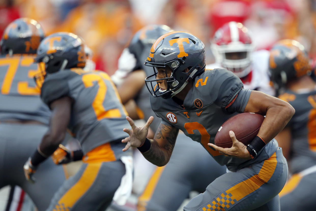 Tennessee quarterback Jarrett Guarantano (2) runs for yardage in the second half of an NCAA college football game against Georgia Saturday, Sept. 30, 2017, in Knoxville, Tenn. Georgia won 41-0. (AP Photo/Wade Payne)