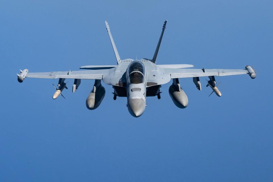 A U.S. Navy E/A-18G Growler approaches before conducting a formation flight with U.S. Air Force F-15E Strike Eagles from Royal Air Force Lakenheath's 494th Fighter Squadron, over the U.S. Central Command area of responsibility, May 2, 2024. The U.S. maintains a highly agile fighting force, which leverages the most advanced training and platforms to dominate the warfighting landscape for the long-term security and stability of the region. (U.S. Air Force Photo)
