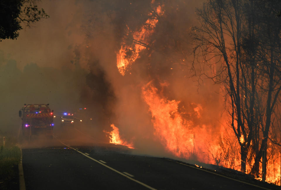 Fire crews tend to a bushfire in Nana Glen, near Coffs Harbour. Source: AAP