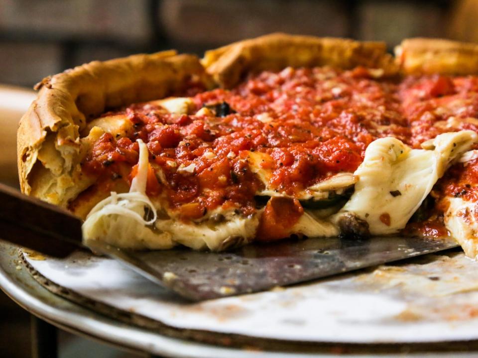 Giordanos chicago deep dish pizza with a serving spatula