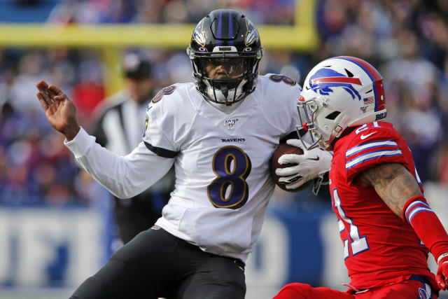 Baltimore Ravens quarterback Lamar Jackson (8) runs out of the