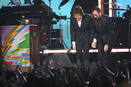 Paul McCartney and Ringo Starr take their bow after performing at the 56th annual Grammy Awards in Los Angeles, California January 26, 2014. REUTERS/ Mario Anzuoni