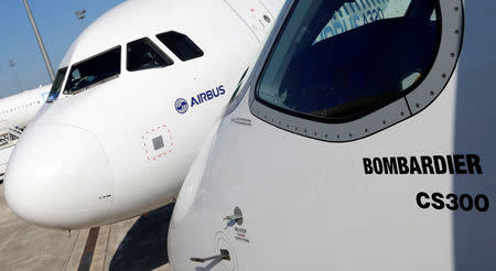 An Airbus A320neo aircraft and a Bombardier CSeries aircraft are pictured during a news conference to announce a partnership between Airbus and Bombardier on the C Series aircraft programme, in Colomiers near Toulouse, France, October 17, 2017. REUTERS/Regis Duvignau