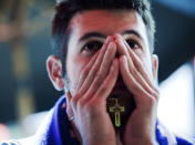 Italy soccer fan Antony Galluccio watches his team lose 4-0 to Spain, at Cafe Diplomatico in Toronto during the Euro 2012 soccer championship final in Kiev, Ukraine. Toronto, Sunday, July 1, 2012. THE CANADIAN PRESS/Michelle Siu