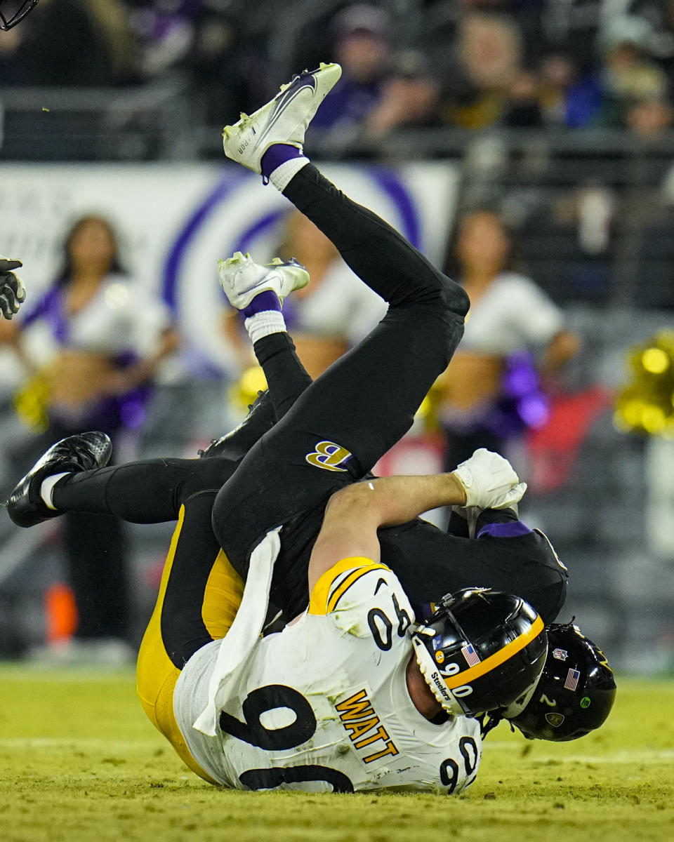 Pittsburgh Steelers linebacker T.J. Watt (90) sacks Baltimore Ravens quarterback Tyler Huntley (2) in the second half of an NFL football game in Baltimore, Fla., Sunday, Jan. 1, 2023. (AP Photo/Julio Cortez)