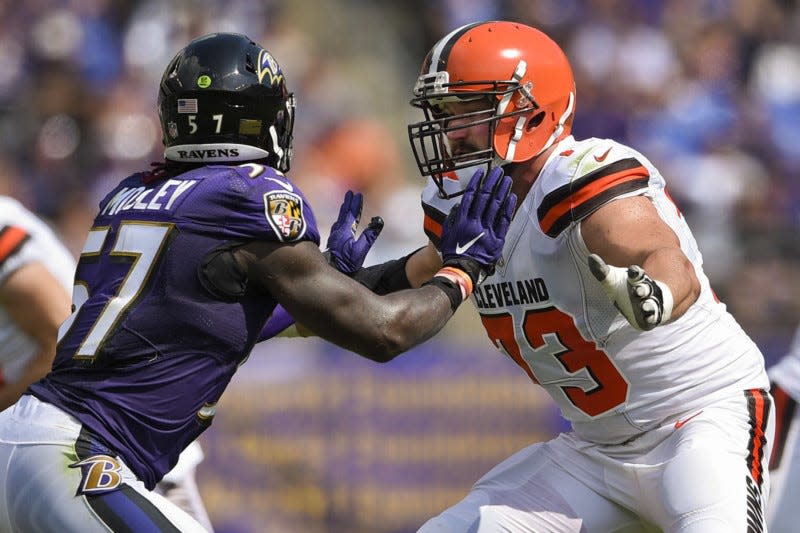 Baltimore Ravens inside linebacker C.J. Mosley (57) and Cleveland Browns offensive tackle Joe Thomas (73) face-off during the first half of a game against the Baltimore Ravens in Baltimore, Sunday. (AP Photo/Nick Wass)