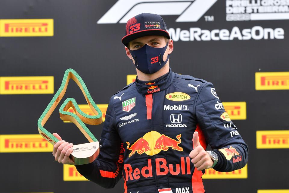 Third placed Red Bull's Dutch driver Max Verstappen celebrates with his trophy on the podium after the Formula One Styrian Grand Prix race on July 12, 2020 in Spielberg, Austria. (Photo by JOE KLAMAR / various sources / AFP) (Photo by JOE KLAMAR/AFP via Getty Images)