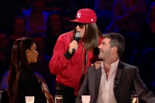 Simon Cowell has signed Honey G to his record label.