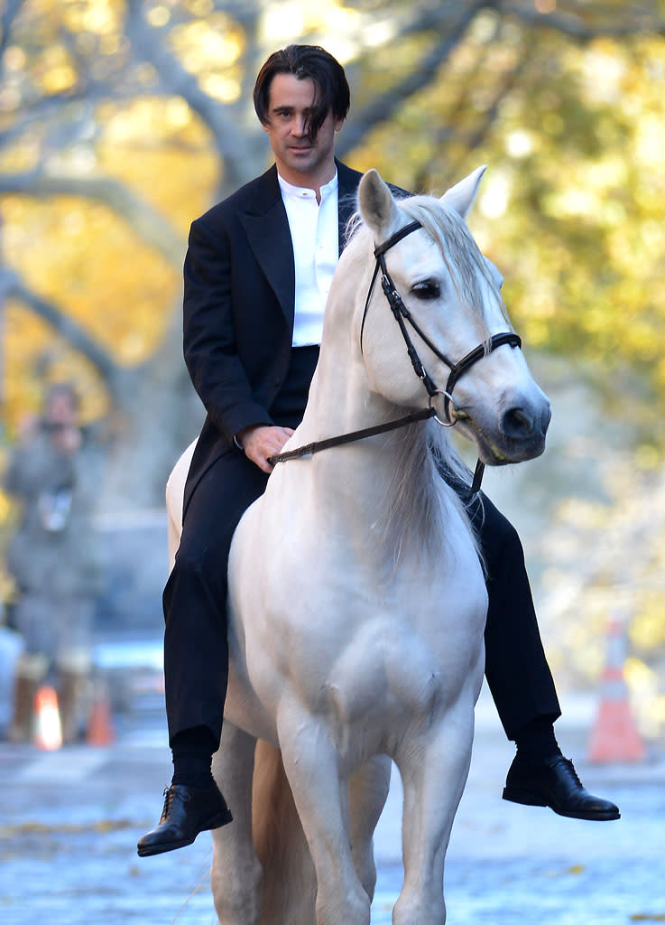 Colin Farrell rides a horse on the set of 'Winter's tale' in Brooklyn, NYC.