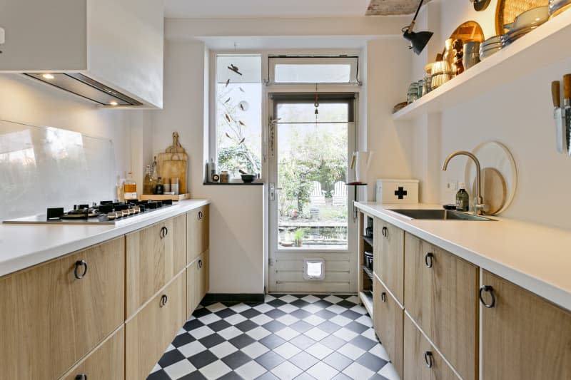 Checkered floor kitchen with white counters