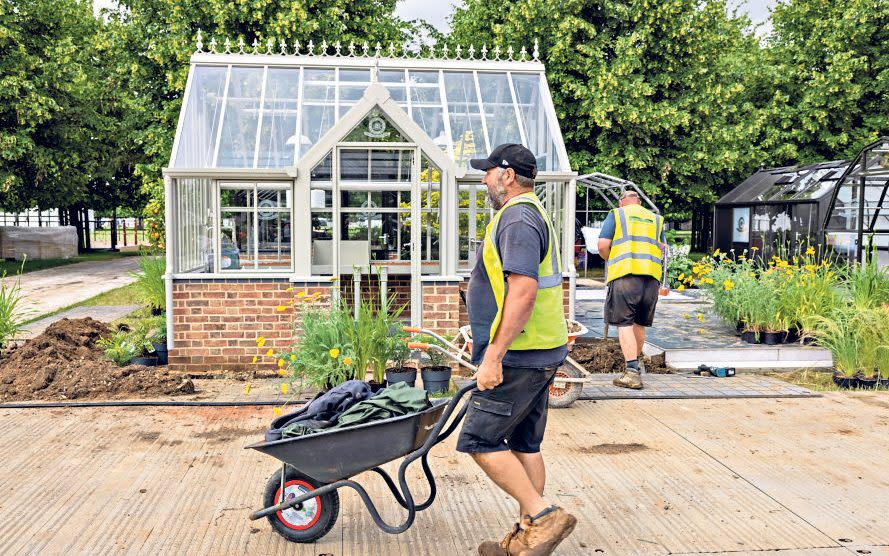 Much sweat and toil goes on in the days leading up to the opening of Hampton Court - Heathcliff O’Malley