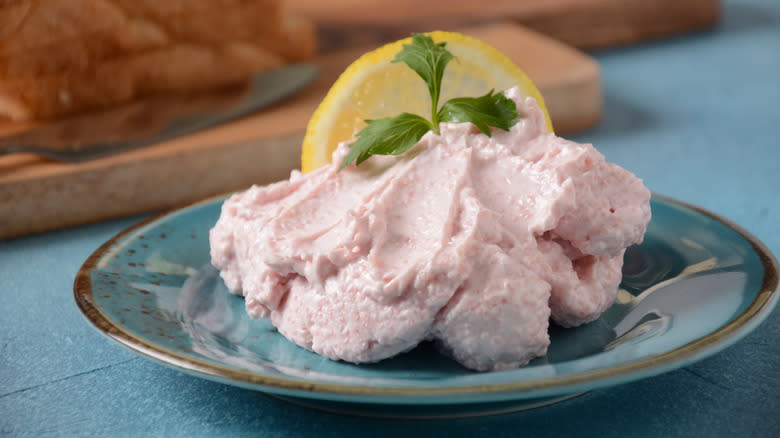 Fish pâté, lemon on plate