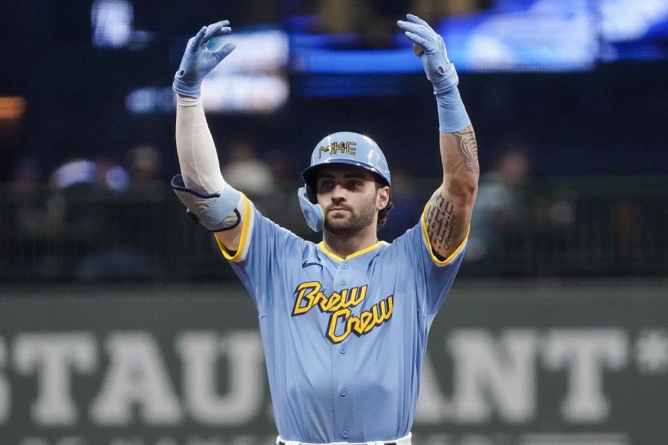 Milwaukee Brewers' Garrett Mitchell reacts after hitting a double during the eighth inning of a baseball game against the Miami Marlins Friday, Sept. 30, 2022, in Milwaukee. (AP Photo/Morry Gash)