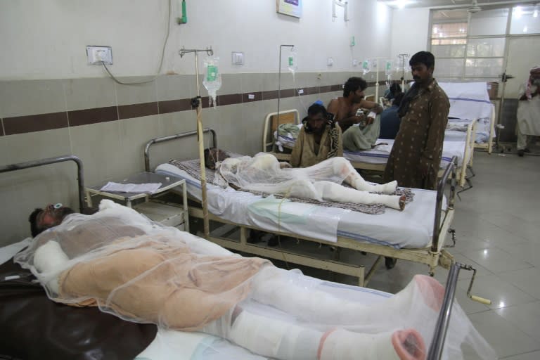 Pakistani burn victims are treated at a hospital in Bahawalpur after an oil tanker caught fire following an accident on a highway near the town of Ahmedpur East