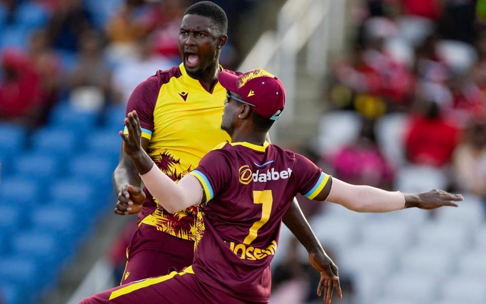 Jason Holder celebrates taking a wicket