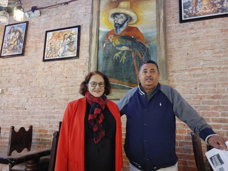 Center City of Amarillo Executive Director Beth Duke and the owner of Braseros Jaime Santillá stand in his restaurant that he restored and was granted a facade grant for.