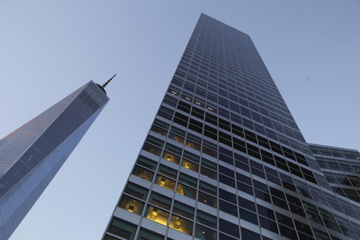 FILE - In this Thursday, Oct. 15, 2015, file photo, Goldman Sachs headquarters, right, neighbors One World Trade Center, in New York. The Goldman Sachs Group, Inc. reports earnings Wednesday, Jan. 17, 2018. (AP Photo/Mark Lennihan, File)