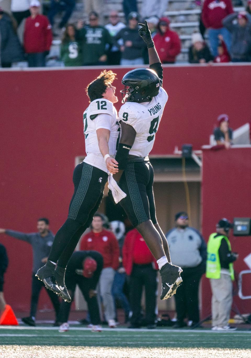 Nov 18, 2023; Bloomington, Indiana, USA; Michigan State Spartans quarterback Katin Houser (12) and Michigan State Spartans defensive lineman Zion Young (9) celebrate stopping IU at the end of the second half at Memorial Stadium. Mandatory Credit: Marc Lebryk-USA TODAY Sports