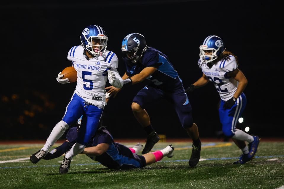 Wood-Ridge running back Jaydin Punt tries to break free from the Waldwick defense in the first half.