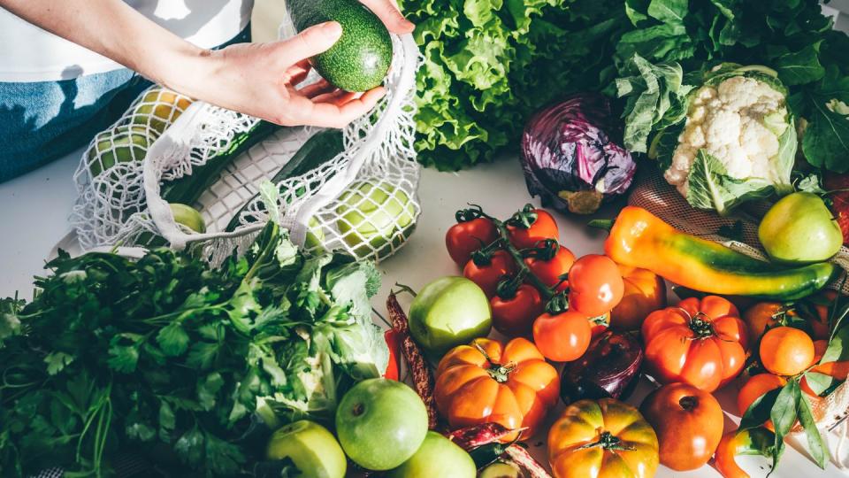 woman takes fresh organic vegetables