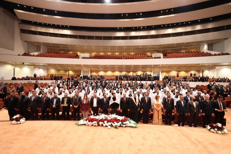 Iraqi lawmakers attend the first session of the new Iraqi parliament in Baghdad