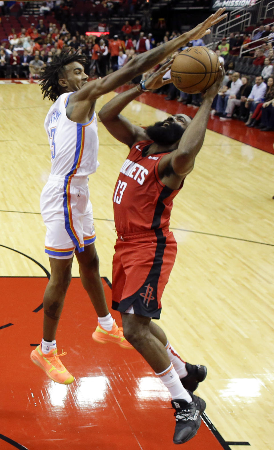 Houston Rockets guard James Harden, right, shoots as Oklahoma City Thunder guard Terrance Ferguson defends during the first half of an NBA basketball game, Monday, Oct. 28, 2019, in Houston. (AP Photo/Eric Christian Smith)