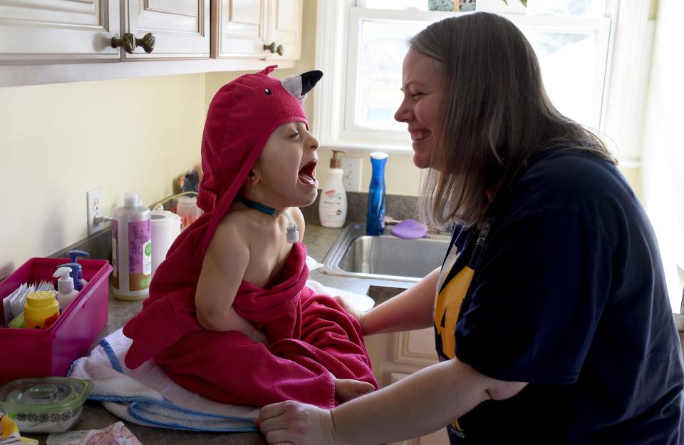 Aurora Lewis, 5, enjoys having fun with mom Nicole Lewis as they sing, laugh after her bath on April 27, 2021. This was the last bath Aurora took before having her trach removed on April 29, 2021. This is one of several images as part of the story on Aurora.