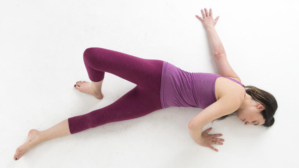 A woman doing a shoulder stretch in yoga