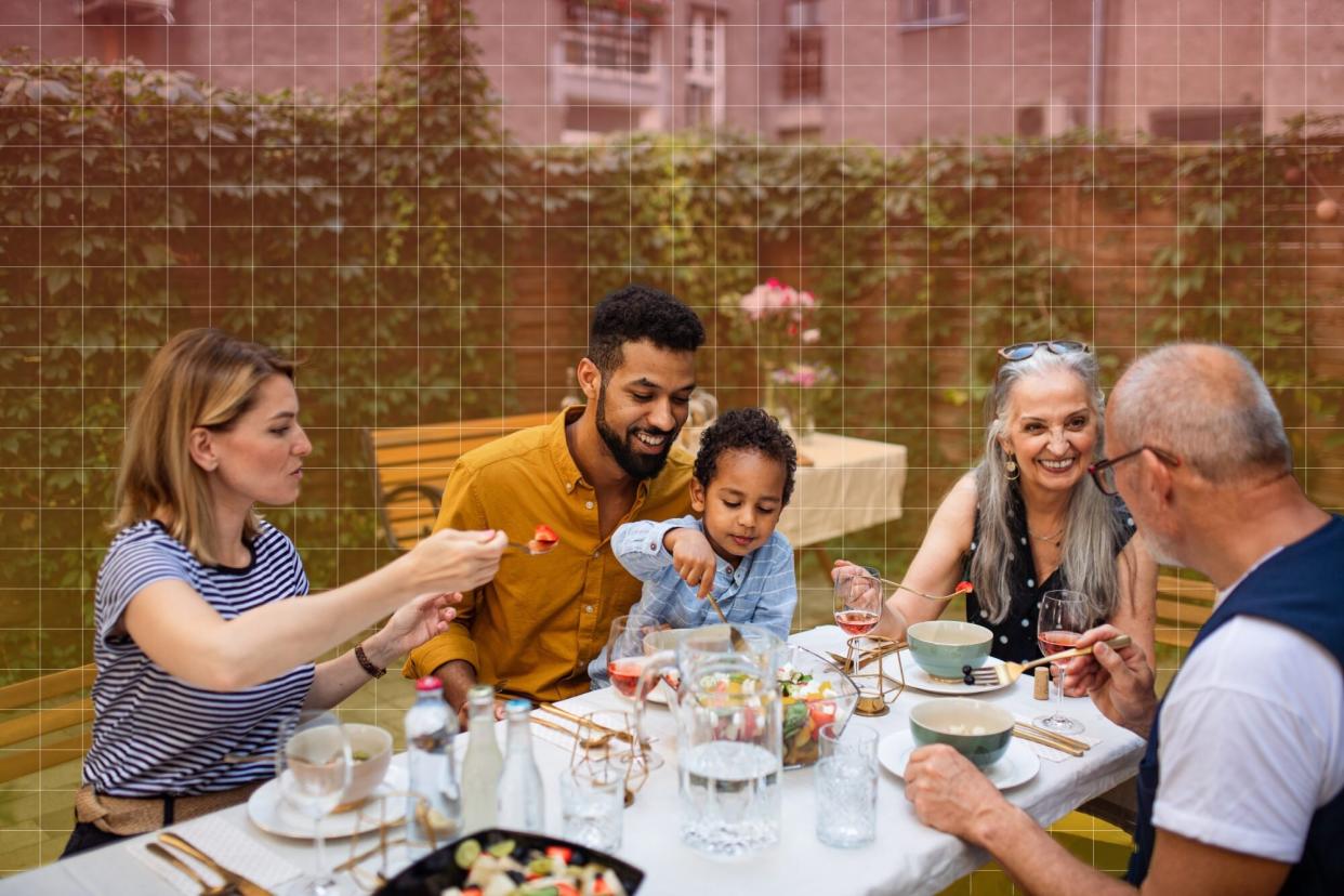 a family having an outdoor dinner together