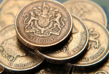 A pile of one pound coins is seen in a photo illustration shot June 17, 2008. REUTERS/Toby Melville/Illustration/File Photo