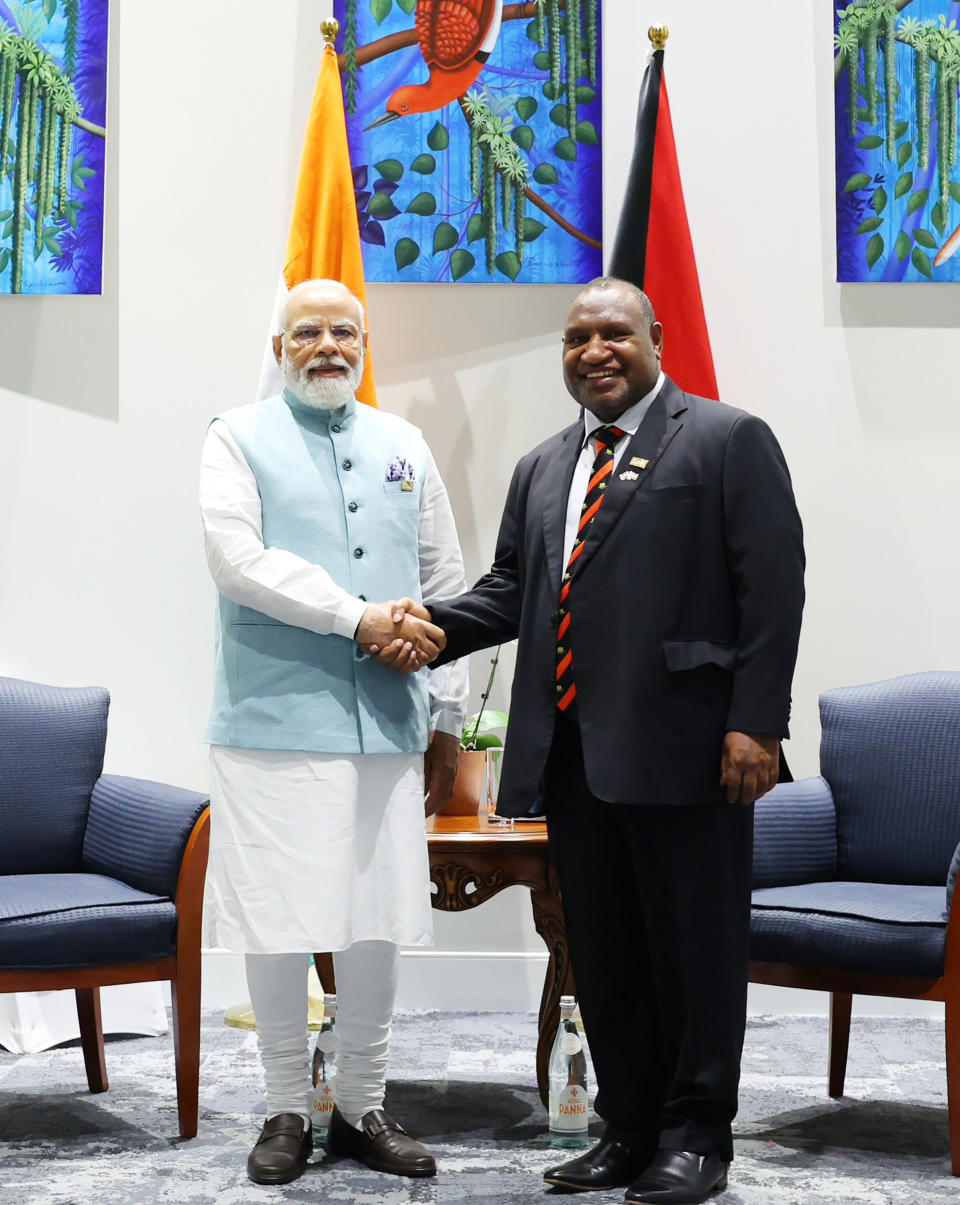 In this photo provided by Prime Minister of India Narendra Modi's twitter handle, Modi shakes hand with Papua New Guinea Prime Minister James Marape in Port Moresby, Papua New Guinea, Monday, May 22, 2023. Modi is meeting with Pacific leaders to discuss better cooperation. (Prime Minister of India Narendra Modi's twitter handle via AP Photo)