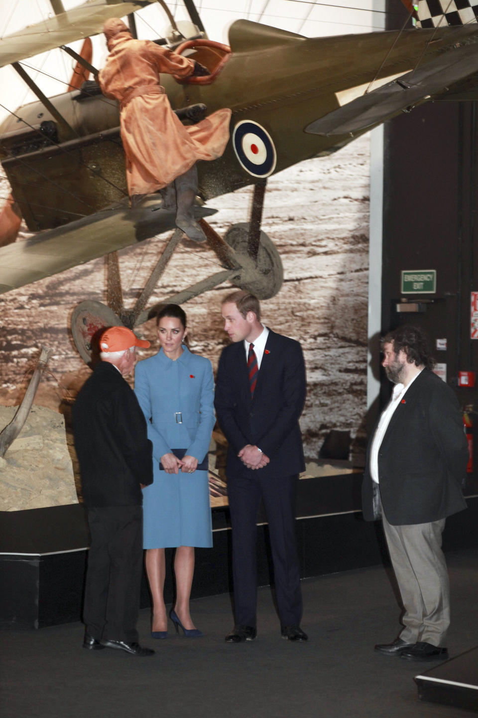 Britain's Prince William, second right, and his wife Kate, the Duchess of Cambridge, meet with former Spitfire pilot Harcourt 'Bunty' Bunt as they are guided on a tour of the Omaka Aviation Heritage Centre by film director Peter Jackson, right, in Blenheim, New Zealand, Thursday, April 10, 2014. (AP Photo/Tim Cuff, Pool)