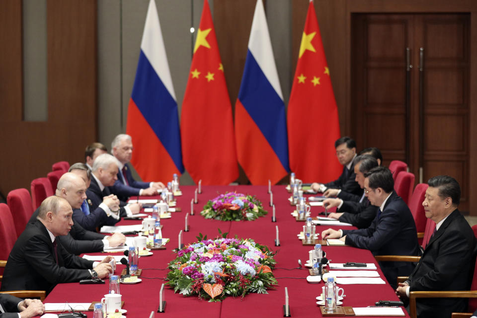 Russian President Vladimir Putin, left, and Chinese President Xi Jinping, right, attend the meeting at Friendship Palace in Beijing Friday, April 26, 2019. (Kenzaburo Fukuhara/Pool Photo via AP)