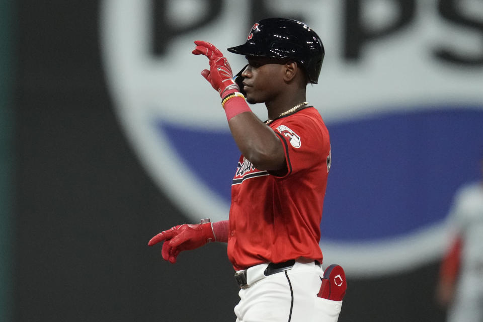 Cleveland Guardians' Angel Martinez gestures from second base after hitting a double in the fifth inning of a baseball game against the Minnesota Twins, Monday, Sept. 16, 2024, in Cleveland. (AP Photo/Sue Ogrocki)