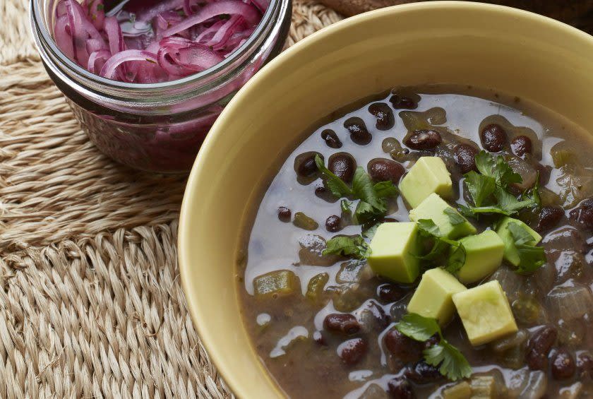 <p>This black bean soup doesn’t need meat to be hearty, flavorful, and packed with energizing protein. A touch of cinnamon, cumin, and perfectly pickled vegetables give this soup a sweet, hot, and sour flavor that is beyond satisfying.<br><br><a href="http://www.thedailymeal.com/recipes/black-bean-soup-lime-pickled-red-onions-recipe" rel="nofollow noopener" target="_blank" data-ylk="slk:For the Black Bean Soup With Lime-Pickled Red Onions recipe, click here.;elm:context_link;itc:0;sec:content-canvas" class="link "><b>For the Black Bean Soup With Lime-Pickled Red Onions recipe, click here.</b></a></p>