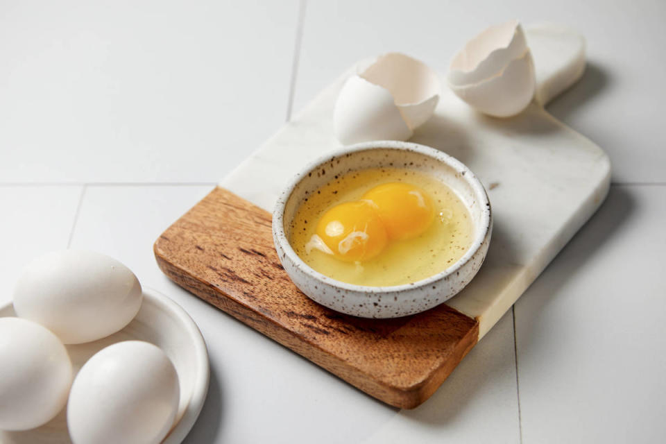 Eggs cracked in a white bowl<p>IMAGO</p>