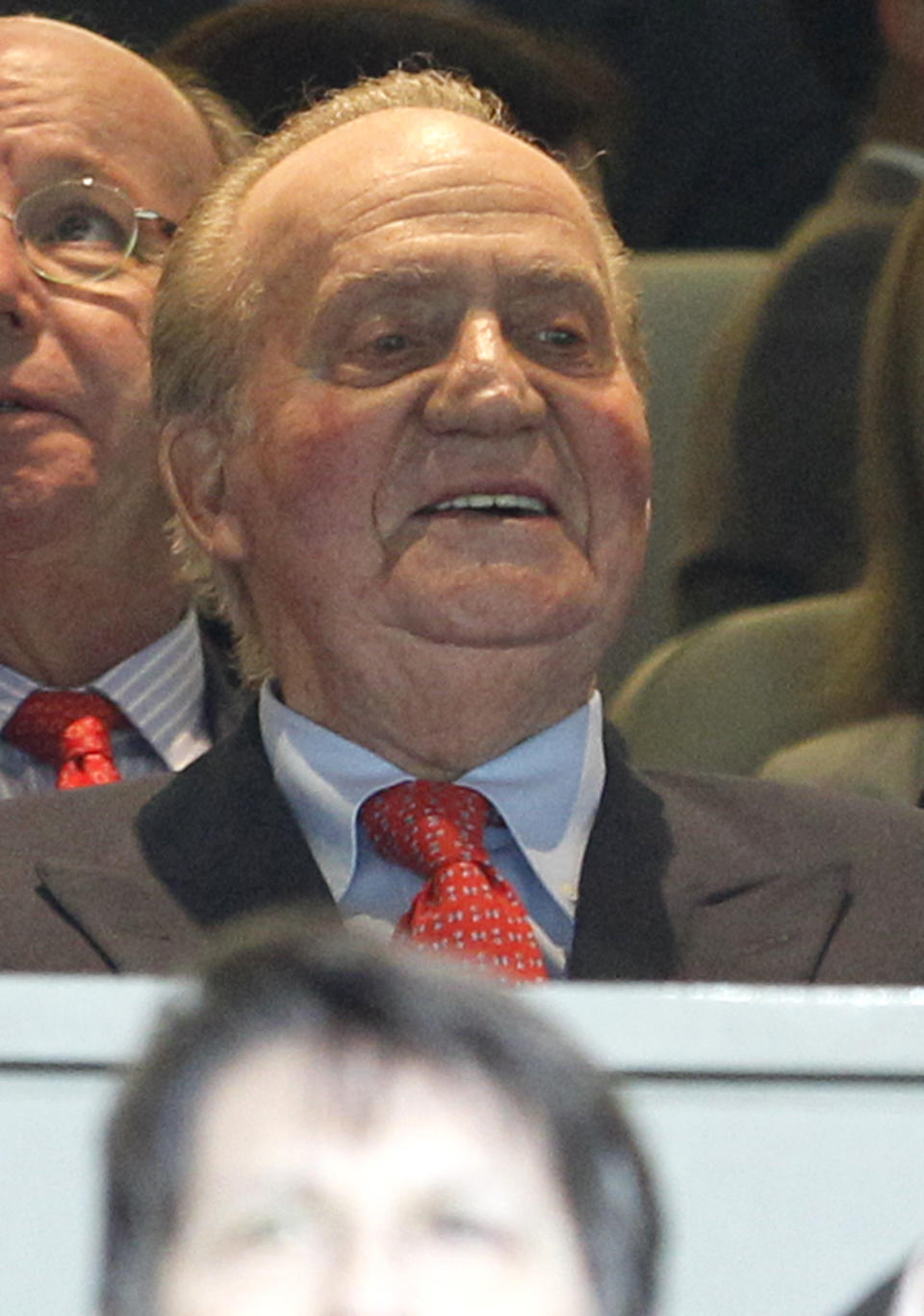 King Juan Carlos of Spain sits in the stands prior to the Champions League semifinal second leg soccer match between Real Madrid and Borussia Dortmund at the Santiago Bernabeu stadium in Madrid, Spain, Tuesday April 30, 2013. (AP Photo/Alberto Di Lolli)