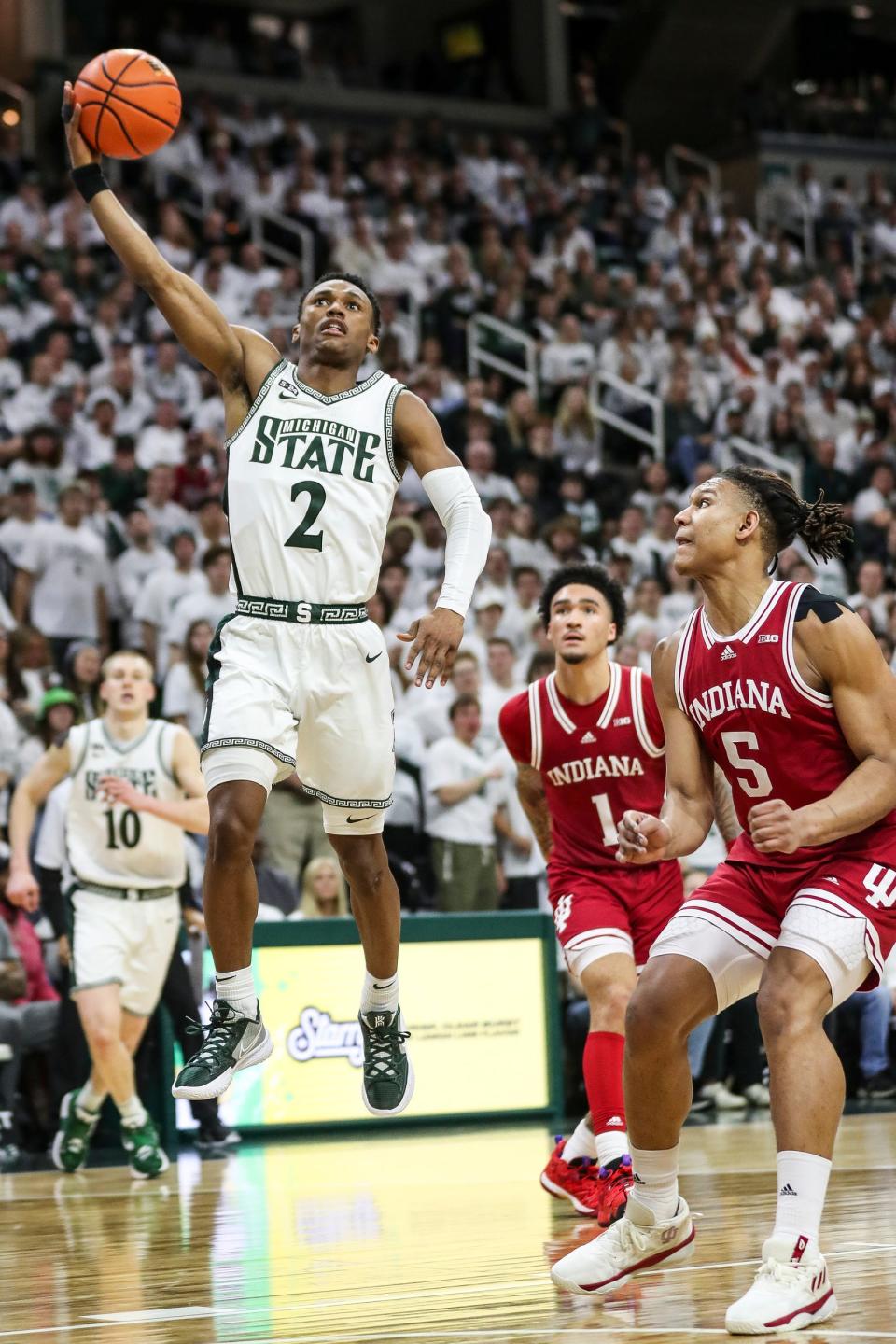 Michigan State guard Tyson Walker makes a layup  against Indiana forward Malik Reneau during the second half of MSU's 80-65 win on Tuesday, Feb. 21, 2023, at Breslin Center.