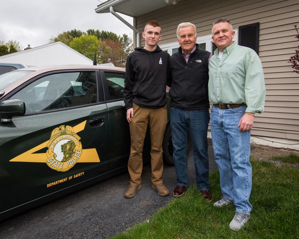 Wayne Vetter (center) with grandson Cameron (left) and son Christopher (right) pose in front of a N.H. State Police cruiser.